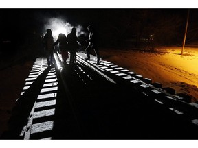 Early Sunday morning, February 26, 2017, eight migrants from Somalia cross into Canada illegally from the United States by walking down this train track into the town of Emerson, Man., where they will seek asylum at Canada Border Services Agency. The Liberal government is taking steps to stem the tide of asylum seekers who've been crossing into Canada from the U.S. at unofficial border crossings.