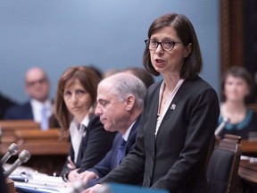 Quebec Health and Social Services Minister Danielle McCann tables a document, Thursday, November 29, 2018 at the legislature in Quebec City. The number of Quebecers seeking medical assistance in dying has been growing steadily since 2015, according to a report on the state of end-of-life care tabled Wednesday in the provincial legislature.