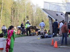 First responders attend the scene of a deck collapse in Langley, B.C. on Friday April 19, 2019.