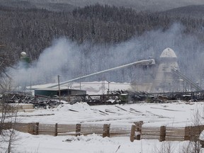 Smoke rises from the Babine Forest Products mill in Burns Lake, B.C. Sunday, Jan. 22, 2012. The union representing four workers who died in two British Columbia sawmill explosions in 2012 says it hopes a new review of worker safety ordered by the provincial government will lead to overdue justice for survivors and families of the victims. Steve Hunt, district director for the United Steelworkers union, said previous inquiries into the explosions at Babine Forest Products and Lakeland Mills raised more questions than answers and he hopes the new review prevents similar disasters from happening in the future.