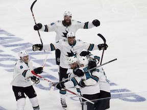 San Jose Sharks celebrate after San Jose Sharks centre Tomas Hertl (48) scored in the second overtime to beat the Vegas Golden Knights 2-1 in Game 6 of an NHL hockey first-round playoff series at T-Mobile Arena Sunday, April 21, 2019.