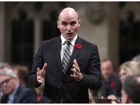 Minister of Families, Children and Social Development Jean-Yves Duclos rises during Question Period in the House of Commons on Parliament Hill in Ottawa on Friday, Oct. 26, 2018. The federal Liberals are using an omnibus budget bill to legislate a "right to housing" and the requirements on future government to not drop the concept.