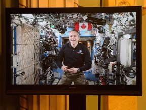 Canadian Space Agency astronaut David Saint-Jacques is seen on a live monitor from the International Space Station during a video conference with Prime Minister Justin Trudeau and Governor General Julie Payette and a group of students at Rideau Hall in Ottawa on Monday, Jan. 14, 2019. Astronaut David Saint-Jacques will become the first Canadian spacewalker in 12 years when he embarks on a roughly seven-hour mission planned for today.