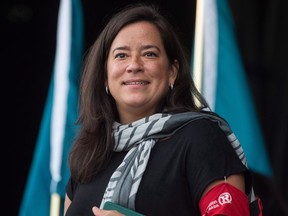 Federal Justice Minister Jody Wilson-Raybould waits to speak after the Walk for Reconciliation in Vancouver, B.C., on Sunday, September 24, 2017. Wilson-Raybould in her Vancouver Granville riding say they're disappointed by the decision of government MPs to eject her from the Liberal caucus but they would back her in the upcoming election if she ran as an Independent.