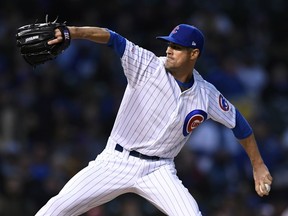 Chicago Cubs starter Cole Hamels delivers a pitch during the first inning of a baseball game against The Los Angeles Dodgers Wednesday, April 24, 2019, in Chicago.