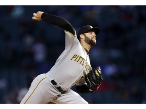 Pittsburgh Pirates' Jordan Lyles throws to a Chicago Cubs batter during the first inning of a baseball game in Chicago, Wednesday, April 10, 2019.
