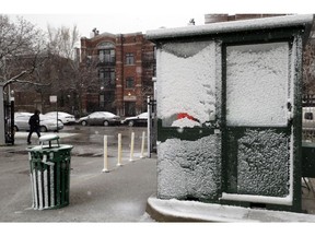 Chicago Cubs parking booth is covered by snow Sunday, April 14, 2019, in Chicago. The Chicago Cubs baseball game against the Los Angeles Angels was postponed due to inclement weather. The makeup date is yet to be determined.