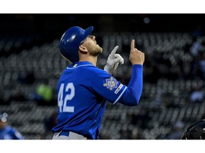 Kansas City Royals' Hunter Dozier points skyward after hitting a home run during the second inning of a baseball game against the Chicago White Sox, Monday, April 15, 2019, in Chicago.