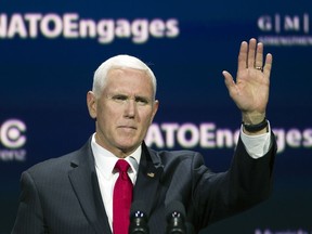 Vice President Mike Pence waves as he speaks at the Atlantic Council's "NATO Engages The Alliance at 70" conference, in Washington, Wednesday, April 3, 2019.