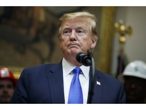 President Donald Trump pauses during remarks on the deployment of 5G technology in the United States during an event in the Roosevelt Room of the White House, Friday, April 12, 2019, in Washington.