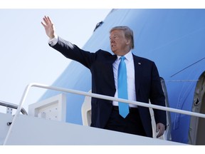 President Donald Trump waves as he boards Air Force One for a trip to Texas, Wednesday, April 10, 2019, at Andrews Air Force Base, Md.