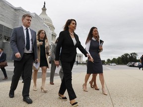 House Speaker Nancy Pelosi of Calif., second from right, arrives for a news conference on veteran suicide prevention with House Veterans' Committee members, Monday April 29, 2019, at the House Triangle on Capitol Hill in Washington.