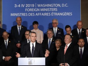 NATO Secretary General Jens Stoltenberg with Secretary of State Mike Pompeo, at front right, speaks during remarks to commemorate NATO's 70th anniversary during a ceremony at Mellon Auditorium in Washington, Wednesday, April 3, 2019.