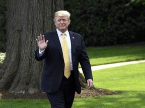 President Donald Trump waves as he arrives to speak on the South Lawn of the White House in Washington, Thursday, April 25, 2019, as part of the activities for Take Our Daughters and Sons to Work Day at the White House.