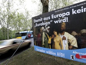 In this Monday, April 29, 2019 photo, an election campaign poster of the German Alternative fuer Deutschland (Alternative for Germany), AfD, party displayed at a road in Berlin, Germany. The poster for the European Parliament elections shows the painting 'Slave Market' from 1866 by the french artist Jean-Leon Gerome. The US museum 'The Clark Art Insitiute' in Williamstown, MA, owner of the painting, has asked the German far right party AfD not to use the picture any more. Top slogan reads 'So that Germany does not become an 'Eurabia'!.