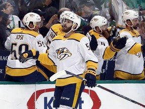 Nashville Predators left wing Austin Watson (51) is congratulated by the bench after scoring against the Dallas Stars in the first period of Game 6 in an NHL hockey first-round playoff series in Dallas, Monday, April 22, 2019.
