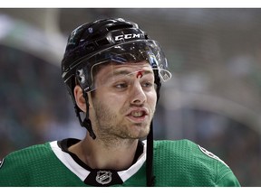Dallas Stars center Jason Dickinson (16) bleeds after being slammed against the boards in the first period of Game 3 in an NHL hockey first-round playoff series against the Nashville Predators in Dallas, Monday, April 15, 2019.