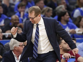 Toronto Raptors head coach Nick Nurse pumps his fist after his team scored a basket against the Orlando Magic during the second half in Game 3 of a first-round NBA basketball playoff series, Friday, April 19, 2019, in Orlando, Fla.