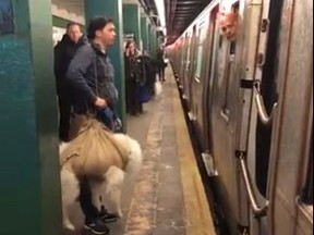 A man argues with an N.Y.C subway conductor about getting on the train with his dog, wrapped in a sack. The conductor does not agree that it's a bag.