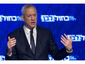 Blue and White party leader Benny Gantz addresses his supporters after Israeli general elections polls closed, Wednesday, April 10, 2019 in Tel Aviv.
