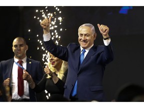 Israel's Prime Minister Benjamin Netanyahu waves to his supporters after polls for Israel's general elections closed in Tel Aviv, Israel, Wednesday, April 10, 2019.
