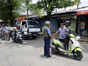 Sri Lankan navy soldiers perform security checks on motorists at a road in Colombo, Sri Lanka, Thursday, April 25, 2019. Sri Lanka banned drones and unmanned aircraft and set off more controlled detonations of suspicious items Thursday four days after suicide bombing attacks killed more than 350 people in and around the capital of Colombo.