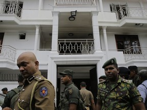 Sri Lankan security forces officers secure a site believed to be a hide out of the militants following a shoot out in Colombo, Sri Lanka, Sunday, April 21, 2019.  More than hundred were killed and hundreds more hospitalized with injuries from eight blasts that rocked churches and hotels in and just outside of Sri Lanka's capital on Easter Sunday, officials said, the worst violence to hit the South Asian country since its civil war ended a decade ago.