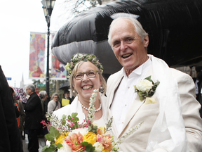 Federal Green Party leader Elizabeth May and her husband John Kidder greet the public following their marriage during Earth Day at the Christ Church Cathedral in Victoria, B.C., on April 22, 2019.