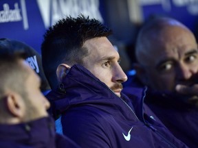 Barcelona forward Lionel Messi sits at the bench during a Spanish La Liga soccer match between Deportivo Alaves and FC Barcelona at the Medizorrosa stadium in Vitoria, Spain, Tuesday, April 23, 2019.