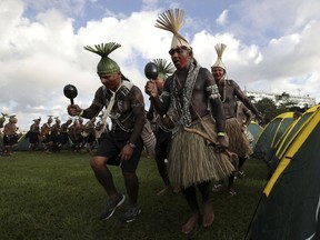 Xucuru indigenous people perform a traditional dance during the annual, three-day campout protest known as The Free Land Encampment, to protest what they see as rollbacks of indigenous rights under President Jair Bolsonaro, in Brasilia, Brazil, Wednesday, April 24, 2019. Before becoming president, Bolsonaro promised that if he were elected, "not one more centimeter" of land would be given to indigenous groups and likened indigenous people living in reserves to caged animals in zoos.