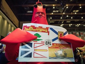 Dressed in a lobster costume, Dorothy MacDonald celebrates the CFL announcing that Halifax's team will be called the Atlantic Schooners, during an event at Grey Cup week, in Edmonton on Friday November 23, 2018.