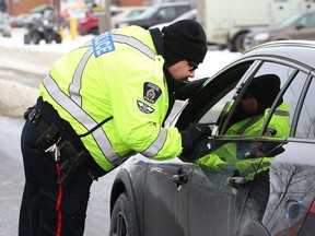 Officers from the Greater Sudbury Police and Ontario Provincial Police conduct spot checks on Municipal Road 80 on Nov. 28, 2018.