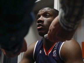 Auburn's Jared Harper answers questions in the locker room after a practice session for the semifinals of the Final Four NCAA college basketball tournament, Thursday, April 4, 2019, in Minneapolis.