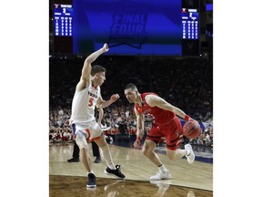 Texas Tech guard Matt Mooney (13) drives past Virginia guard Kyle Guy (5) during the first half in the championship game of the Final Four NCAA college basketball tournament, Monday, April 8, 2019, in Minneapolis.