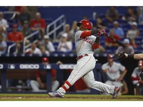 Philadelphia Phillies' Jean Segura hits a two run home run during the 14th inning of a baseball game against the Miami Marlins, Sunday, April 14, 2019, in Miami.