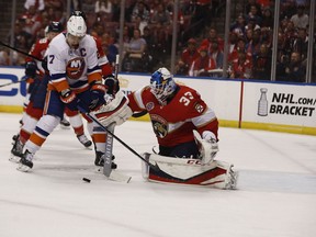 Florida Panthers goaltender Sam Montembeault (33) saves a goal against New York Islanders left wing Anthony Beauvillier (18) during the first period of an NHL hockey game on Thursday, April 4, 2019, in Sunrise, Fla.
