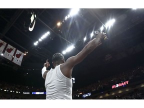 Miami Heat guard Dwyane Wade celebrates with the crowd after playing in his final NBA basketball game, against the Philadelphia 76ers on Tuesday, April 9, 2019, in Miami.