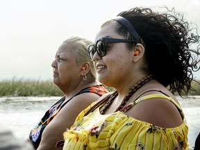 In this April 15, 2019 photo, Elina Llmas and her mother Miriam Llamas ride on an airboat tour through the Florida Everglades. Llamas said Visit Florida's campaigns inform potential visitors about largely unknown attractions outside of beaches and amusement parks. Visit Florida, the state's tourism agency, is caught in the middle of a funding dispute among lawmakers. Governor Ron DeSantis wants to continue to fully fund the agency, while the Senate wants to cut its budget by $45 million. Meanwhile, the house seeks to eliminate the agency altogether, funding it until October.
