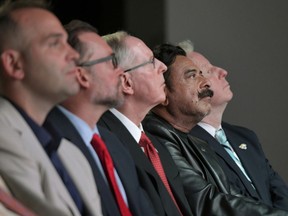 Jacksonville Jaguars general manager Dave Caldwell, left, Jacksonville Mayor Lenny Curry, Jaguars vice president of football operations Tom Coughlin. owner Shahid Khan and Khan spokesman Jim Woodcock listen to Jaguars president Mark Lamping speak during the NFL football team's annual State of the Franchise presentation Thursday, April 18, 2019 at TIAA Bank Field in Jacksonville, Fla.
