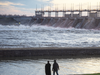 Water rushes through the Carillon Hydro electric dam, April 25, 2019 in Carillon, Quebec. Authorities issued an evacuation alert further up river warning that the Belle Chutes dam is at risk of failing.