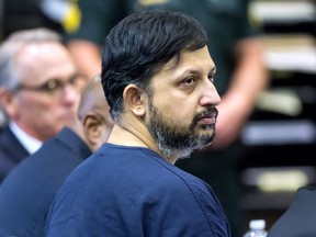 Nouman Raja listens to Chief Assistant State Attorney Adrienne Ellis during his sentencing hearing Thursday, April 25, 2019 in West Palm Beach, Fla. Raja, a former Palm Beach Gardens police officer, was convicted on one count each of manslaughter by culpable negligence and first-degree attempted murder. in the killing of  stranded motorist Corey Jones Oct. 18, 2015.