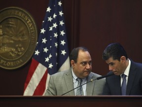 Rep. Ray Rodrigues, R-Estero and House Speaker Jose Oliva, R- Miami Lakes, confer during debate over House Bill 7089 - Voting Rights Restoration, Tuesday April 23, 2019 in the Florida House of Representatives in Tallahassee, Fla.