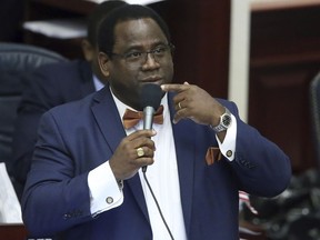 Rep. Wengay Newton, D-St. Petersburg, debates an immigration bill during session Wednesday April 24, 2019, in Tallahassee, Fla. The Florida House has passed a high-profile Republican bill requiring local law enforcement agencies to cooperate with federal immigration authorities and banning so-called "sanctuary city" policies that shield immigrants who are arrested.