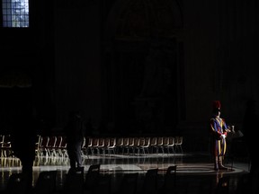 A Swiss Guard stands attention prior to a Holy Thursday Mass with blessing of oils, in St. Peter's Basilica, at the Vatican,Thursday, April 18, 2019.
