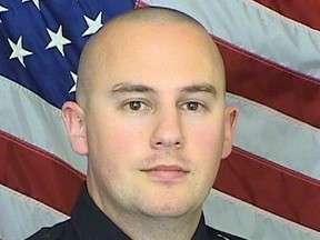 FILE - This undated file photo provided by the Douglas County Sheriff's Office shows Sheriff's Deputy Zackari Parrish. The Democrat-controlled Colorado Legislature sent a "red flag" bill Monday, April 1, 2019, to the governor that calls for taking firearms from people who police say pose a threat to themselves or others. Gov. Jared Polis, also a Democrat, has pledged to sign the measure that would place the state among 13 others that have passed such legislation. Several law enforcement officials testified for the bill, named after Zackari Parrish, a 29-year old sheriff's deputy in Douglas County. The husband and father was shot and killed in a New Year's Eve 2017 shooting by a man who had exhibited increasingly erratic behavior. (Douglas County Sheriff's Office via AP, File)