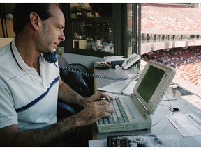 FILE - In this Aug. 11, 1998, file photo, Associated Press sports writer Rob Gloster works in the press box at Candlestick Park in San Francisco. Gloster, a longtime AP Sports Writer who covered Olympics, tennis Grand Slams and other assignments across the globe while working in a variety of bureaus, has died only two days after covering his final game for The Associated Press between the Tampa Bay Rays and San Francisco Giants. Gloster's wife, Sharon, said he died Tuesday, April 9, 2019, in a Bay Area hospital from complications of pancreatic cancer.