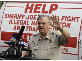 FILE - In this July 29, 2010, file photo Maricopa County Sheriff Joe Arpaio announces plans for traffic patrols that targeted immigrants. Officers at the sheriff's office in metro Phoenix have made 52% fewer traffic stops in the years since a judge concluded they had racially profiled Latinos in then Arpaio's immigration patrols. Arpaio's successor, Sheriff Paul Penzone, and others tell The Associated Press that the decrease is driven by officers' fears that they'll be unfairly scrutinized in a court-ordered overhaul that's aimed at ridding the agency of its biased policing.