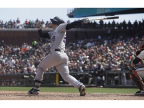Colorado Rockies' Nolan Arenado hits a three-run home run against the San Francisco Giants during the fifth inning of a baseball game in San Francisco, Sunday, April 14, 2019.
