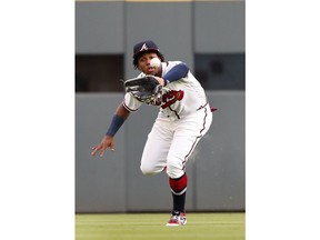 Atlanta Braves centerfielder Ronald Acuna Jr. (13) makes a running catch to retire San Diego Padres' Greg Garcia in the first inning of a baseball game Tuesday, April 30, 2019, in Atlanta.