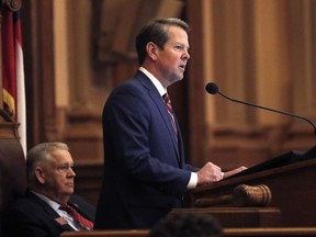 Georgia Gov. Brian Kemp, right, speaks to members of the Georgia House as House Speaker David Ralston looks on during the final 2019 legislative session at the State Capitol Tuesday, April 2, 2019, in Atlanta.